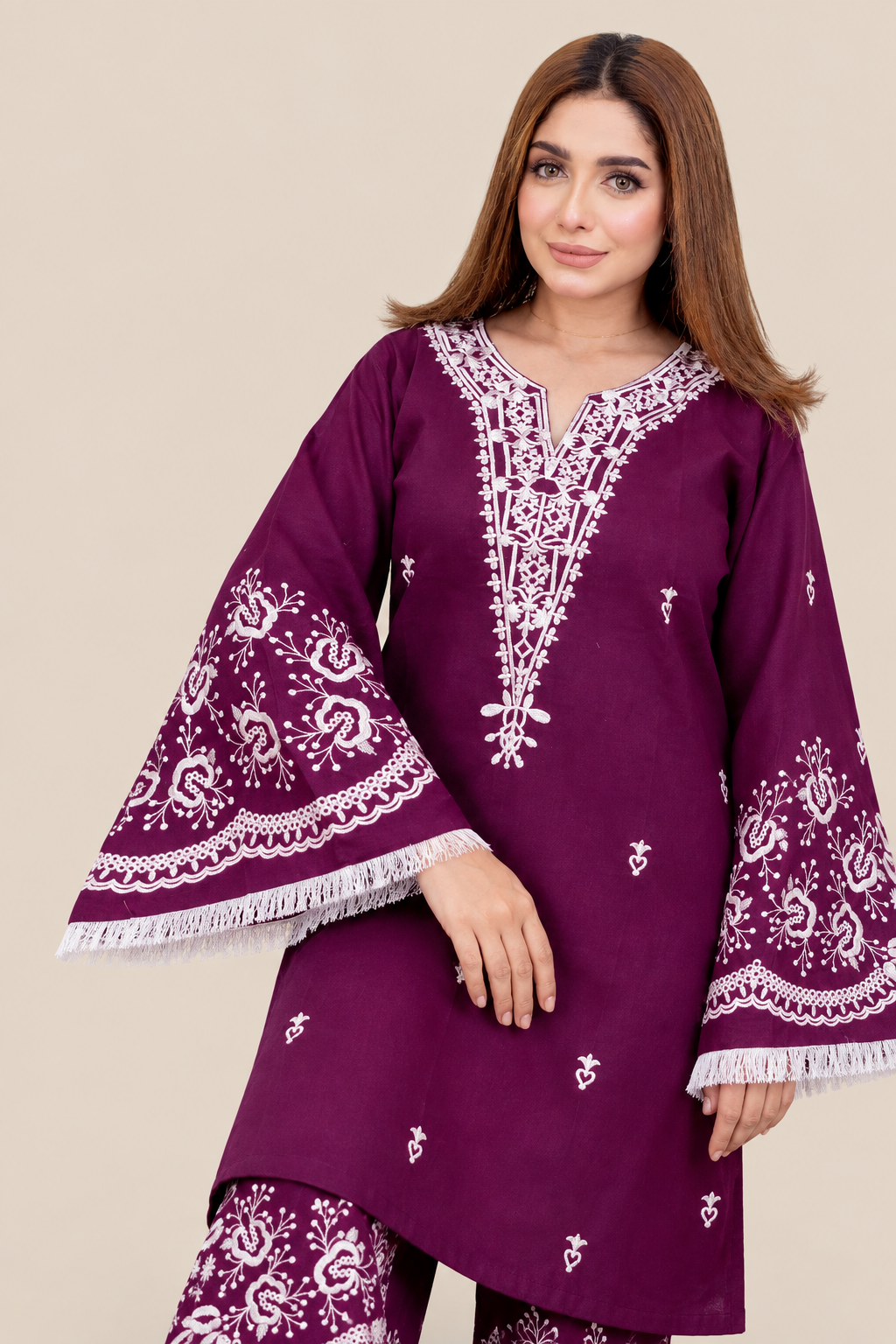Sleeve embroidery and fringe detail