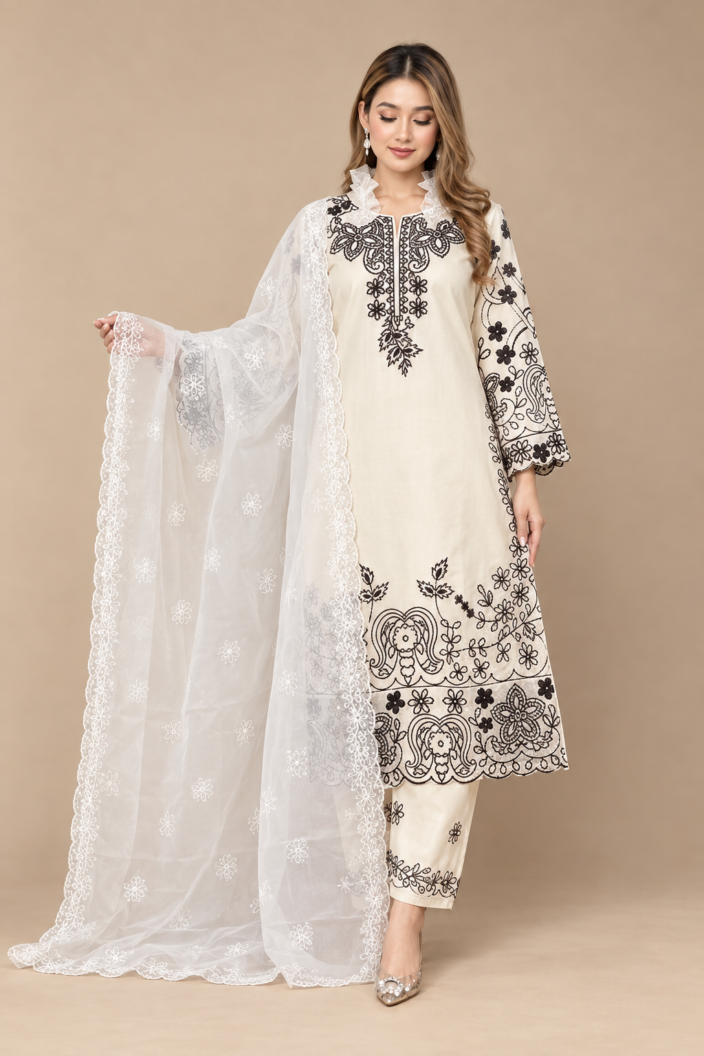 Studio-style image of the embroidered outfit